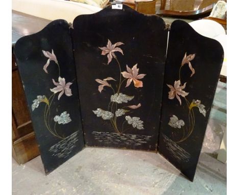A Japanese style tole peinte three-fold fire screen, 120cm wide.