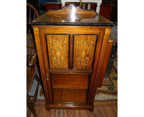 A late Victorian rosewood inlaid display cabinet, with panelled doors, 55cm wide x 110cm high.