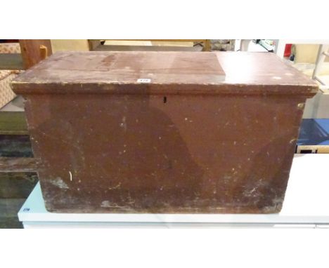 An early 20th century brown painted lift top trunk, 75cm wide x 41cm high. 
