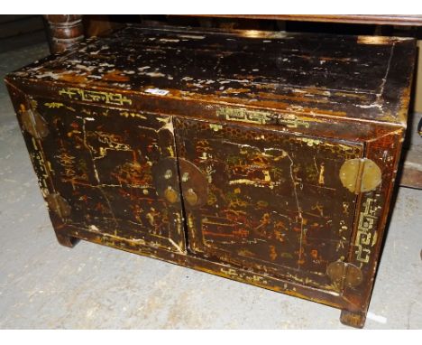 A late 19th century Chinese black lacquer chinoiserie decorated two door cabinet, 89cm wide x 53cm high.