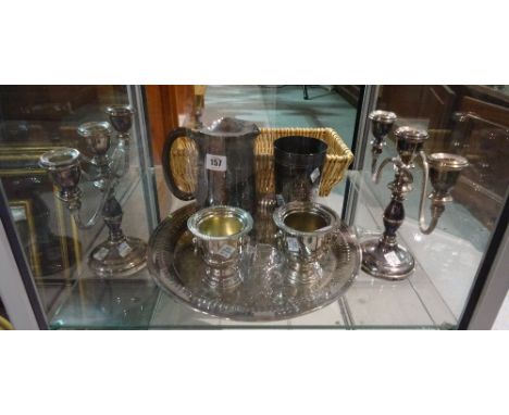 Silver plated wares, including; a circular salver, a pair of table candelabra, a pair of urn shaped salts and a quantity of f