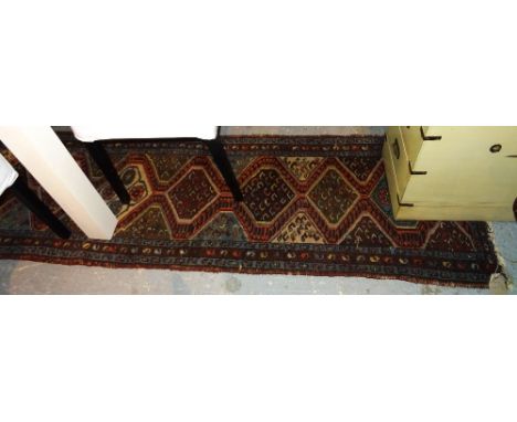 A Tabriz runner 276cm x 72cm. 