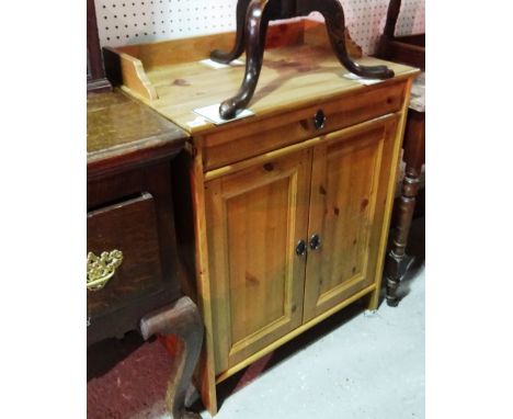 A 20th century pine side cabinet with single drawer over a pair of cupboards, 67cm wide. 