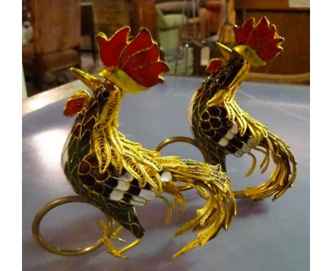 A quantity of gilt metal and enamel napkin rings formed as cockerels. 