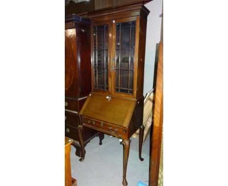 A 19th century mahogany bureau display cabinet, on tapering hoof supports.