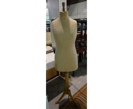 A 20th century tailor's dummy on a beech tripod base, 155cm high.