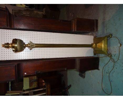 A 19th century gilt brass corinthian column oil lamp, converted to electricity with square base and lion paw feet, 160cm wide
