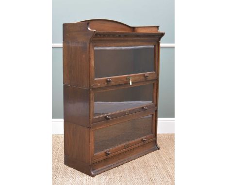 VINTAGE LEBUS OAK BOOKCASE, three tiers with glazed doors and locks, Clarabut (Deal) retailer's label behind, 88w x 33d x 122