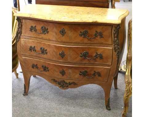 A French Kingwood and Marble Top Three Drawer Bombé Shaped Commode, first half 20th century, with metal mounts, 105cm by 49cm