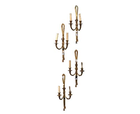 A Set of Four Gilt Metal Twin Light Wall Sconces, with beaded drip trays, supported on twist sconces on ribbon tied backs, 67