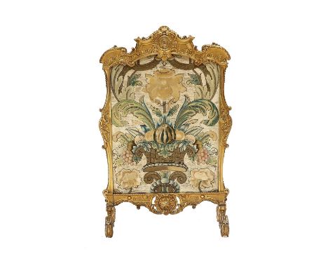 A Victorian Gilt and Gesso Firescreen, mid 19th century, containing a needlework panel with gold thread depicting a vase issu