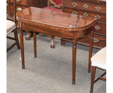 A George III Mahogany Fold-Over Tea Table, of D form, boxwood stringing, on ring turned legs, 92cm by 46cm by 69cmIn good ove