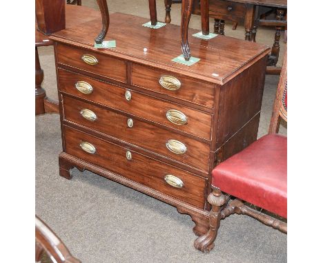 A George III Mahogany Straight Front Chest of Drawers, two short over three graduated, oval gilt-metal handles, bracket suppo