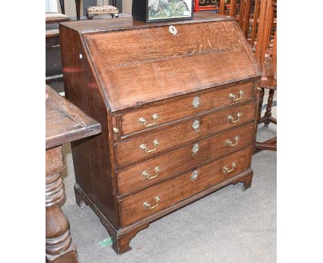 A George III Oak Bureau, banded in mahogany and with bracket supports, 100cm by 54cm by 111cmSides and fall split, some repla