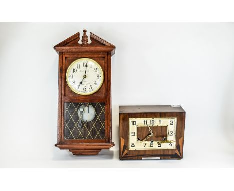 Art Deco Mantle Clock Rectangular clock with fan design inlay to bottom corners, large stylised square dial and numerals, cen