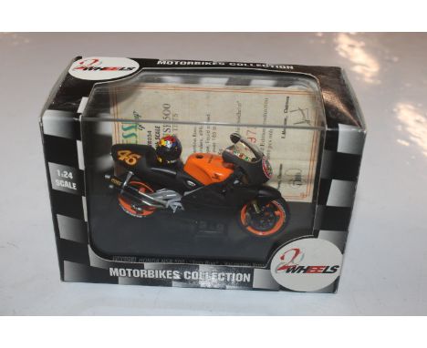 A Minichamps scale model "Valentino Rossi's Honda RC211V in Repsol Team colours; a Minichamps scale model "Carl Fogerty's Wor