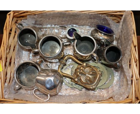 A wicker basket and contents of silver plated ware and a brass door knocker 