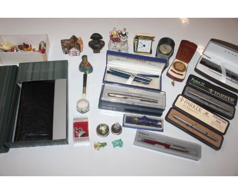 A box containing various small ornaments; Parker and other fountain pens; a looping 8 day alarm clock etc.