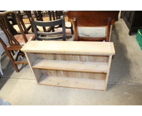 A stripped pine hanging shelf 