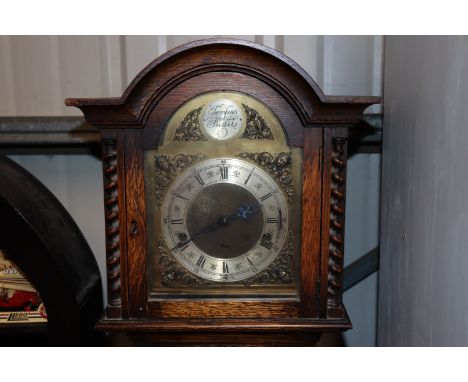 An oak cased Tempus Fugit grandmother clock