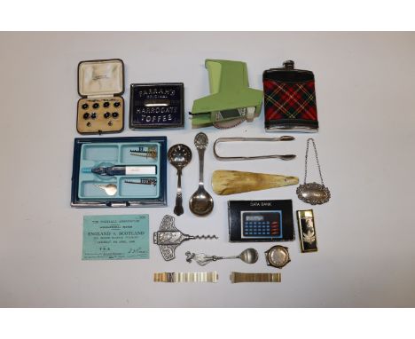 A box containing silver decanter label, cased cuff-links and studs; a Timex wrist watch; hip flask etc. 