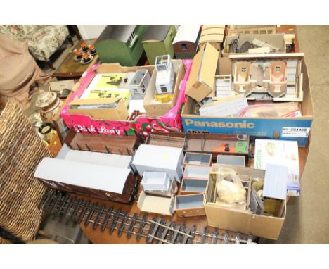 A quantity of various model railway items to include boxed and unboxed, large carriages, rolling stock, engine parts etc.