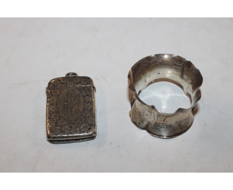 A silver vesta case and a silver napkin ring 