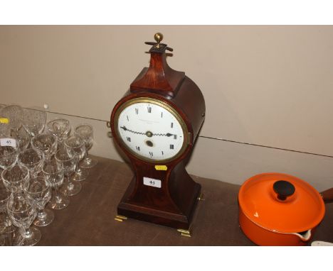 A mahogany cased balloon shaped mantel clock by Dwerrihouse &amp; Carter of London - key on rostrum&nbsp;