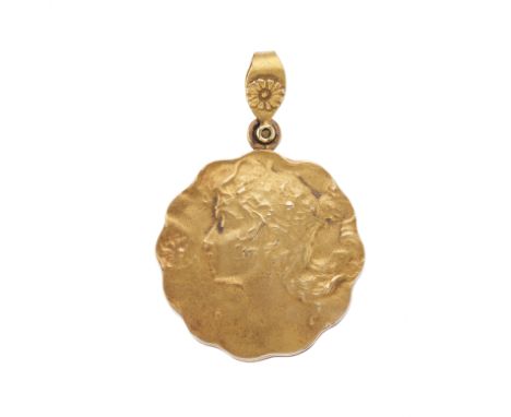 An Art Nouveau 15ct gold portrait locket pendant, designed to depict a goddess in profile, with floral surmount, stamped 15c,