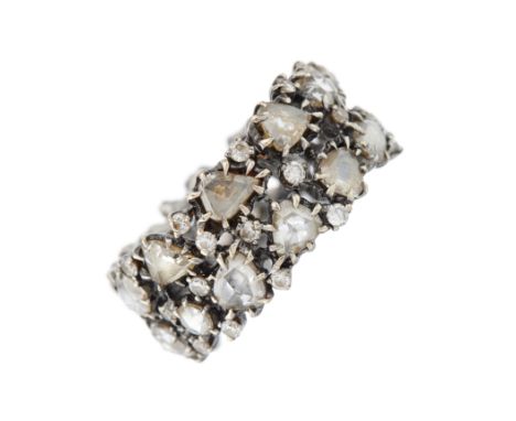 An 18ct gold rose-cut diamond full eternity openwork band ring, with scattered brilliant-cut diamond accents, band stamped 18