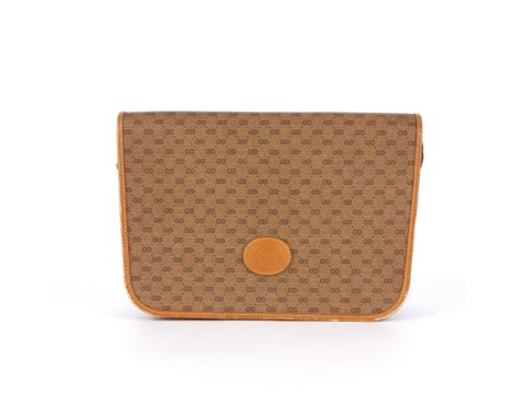 Gucci, a vintage messenger flap handbag, crafted from the maker's beige micro monogram coated canvas, with caramel leather tr