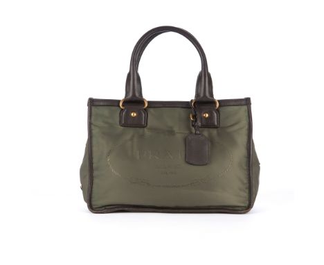 Prada, a jacquard nylon tote, crafted from green nylon with brown leather trim and brushed gold-tone hardware, featuring the 
