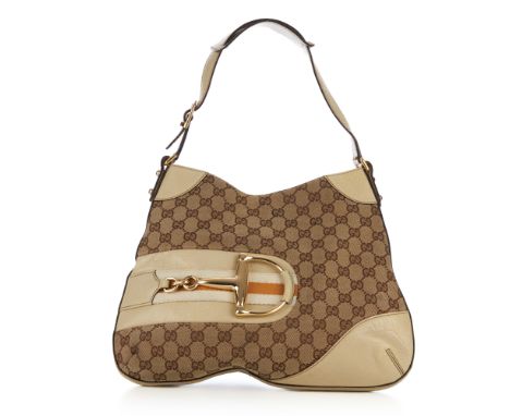 Gucci, a Hasler handbag, featuring the maker's classic beige GG canvas with cream leather trim and gold-tone front horsebit h