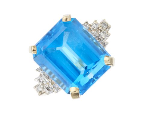 A 14ct gold blue topaz dress ring, with brilliant-cut diamond triangular-shape sides and tapered shoulders, topaz estimated w