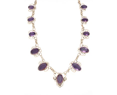 An Arts & Crafts gold, graduated oval-shape amethyst necklace, with trefoil imitation pearl highlight and trace-link back cha