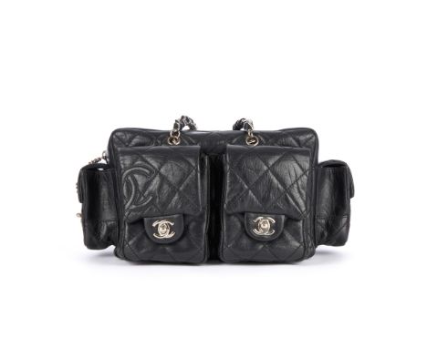 Chanel, a Ligne Cambon Reporter handbag, featuring a black quilted crinkled leather exterior with applied leather CC side log