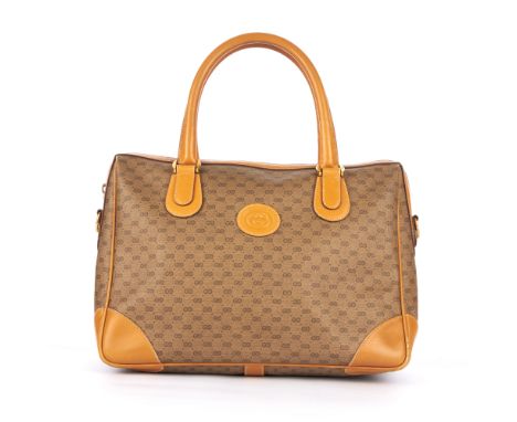 Gucci, a vintage shopping tote, crafted from beige micro monogram coated canvas and caramel leather trim, featuring a front s