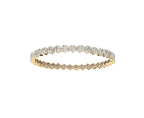 A 14ct gold brilliant-cut diamond cluster bangle bracelet, with grooved sides, estimated total diamond weight 7.50ct, I-K col