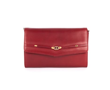 Gucci, a vintage leather handbag, crafted from smooth red calfskin leather, with a detachable leather shoulder strap, magneti