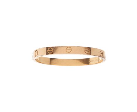Cartier, an 18ct gold Love bangle bracelet, with screw head motif highlights, signed Cartier, serial IKW213, stamped Au750, C