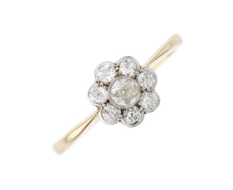An early 20th century 18ct gold old-cut diamond floral cluster ring, with tapered shoulders, estimated total diamond weight 0