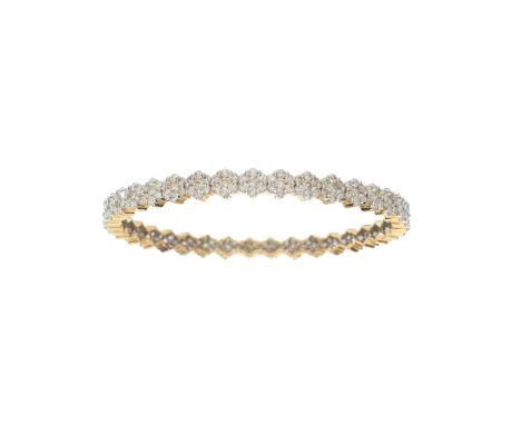 A 14ct gold brilliant-cut diamond cluster bangle bracelet, with grooved sides, estimated total diamond weight 7.50ct, I-K col