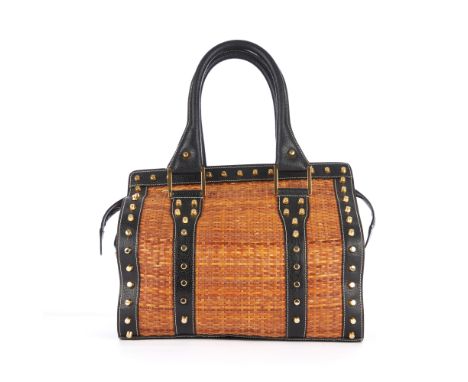 Fendi, a wicker Doctor bag, designed with a woven wicker exterior with black leather trim and gold-tone studded embellishment