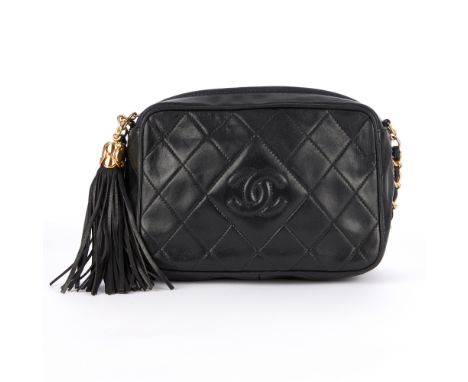 Chanel, a vintage Tassel camera bag, designed with a black quilted lambskin leather exterior, featuring the maker's embroider