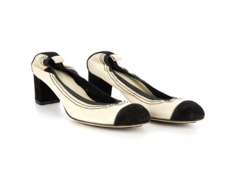 Chanel, an unworn pair of elasticated heeled pumps, designed with cream leather uppers with black suede top cap and block hee
