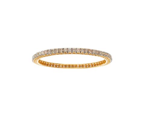 A 14ct gold brilliant-cut diamond line bangle bracelet, with heart-shape openwork sides, estimated total diamond weight 8ct, 