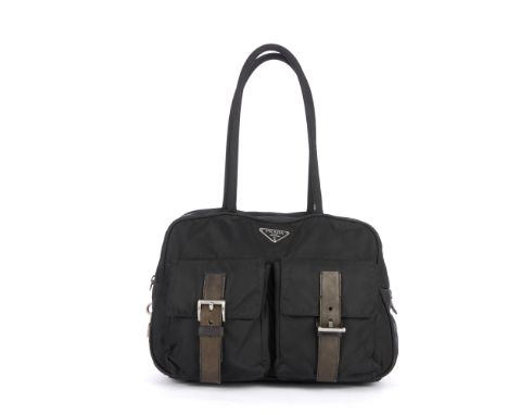Prada, a black nylon handbag, featuring black leather trim, two front patch pockets with buckle fastenings, tall looping top 