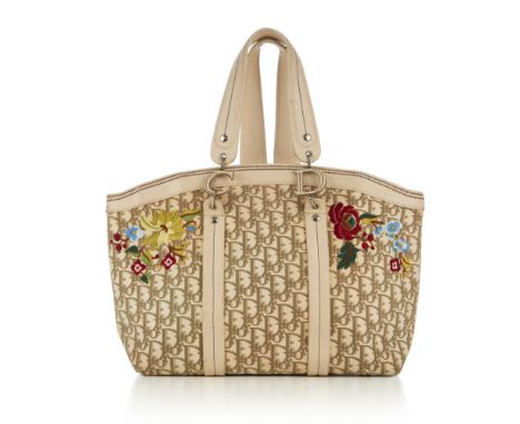 Christian Dior, an embroidered Diorissimo canvas tote, crafted from the maker's ivory and beige logo canvas with cream leathe
