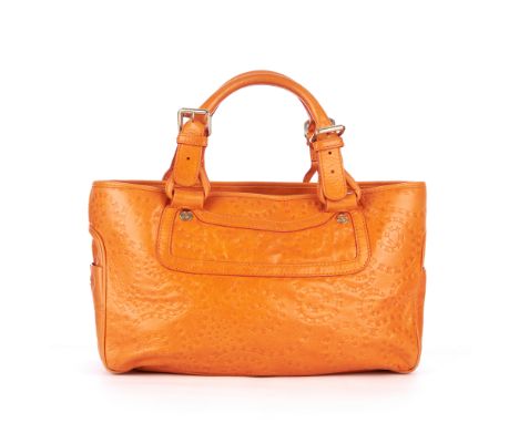 Celine, a Boogie handbag, featuring a spiral macadam embossed orange leather exterior, with pale gold-tone hardware, two smal