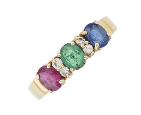 An 18ct gold oval-shape ruby, sapphire and emerald three-stone ring, with brilliant-cut diamond double spacers and tapered ba